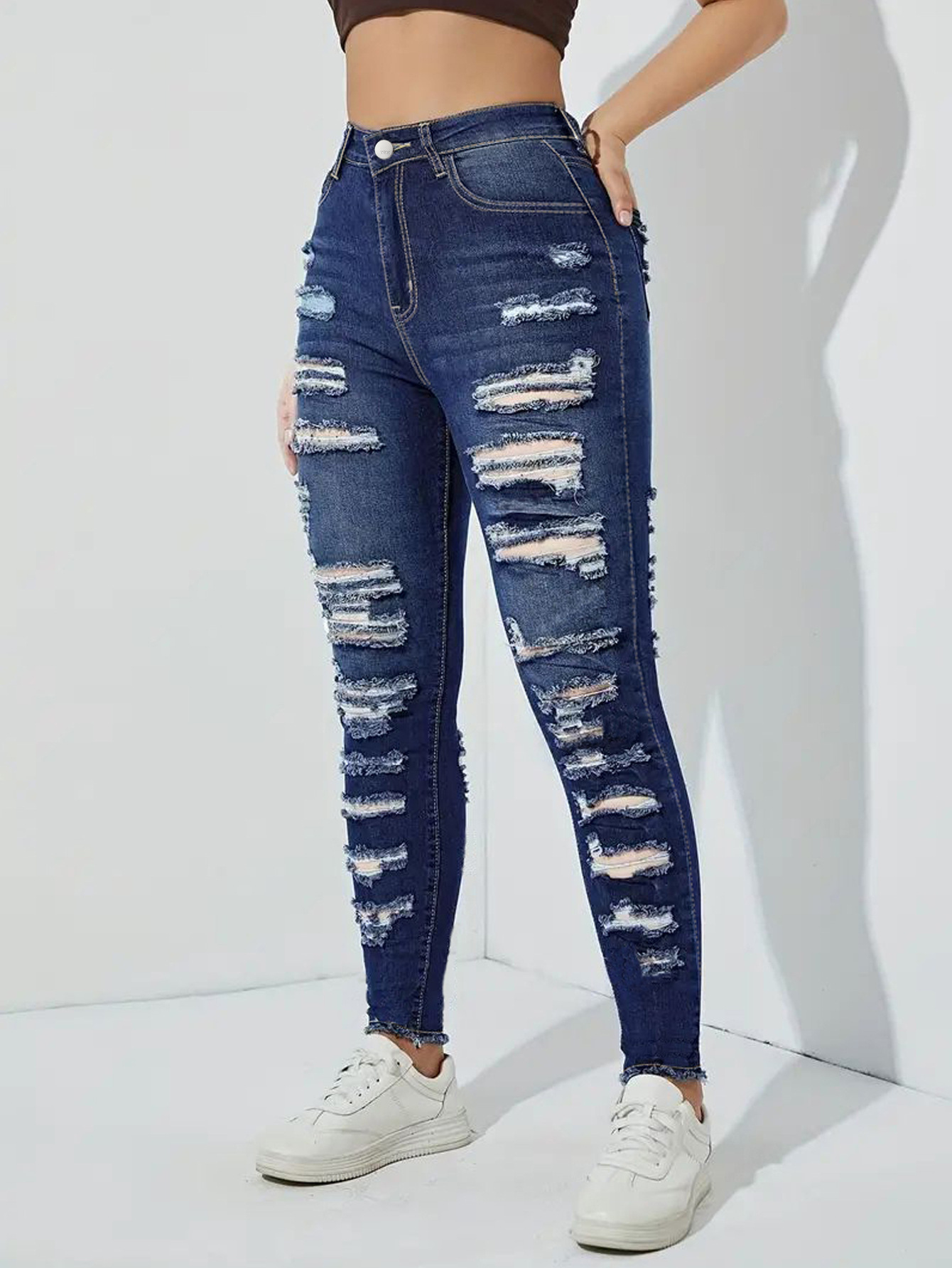 High Waist Distressed Skinny Jeans with Heavily Ripped Design